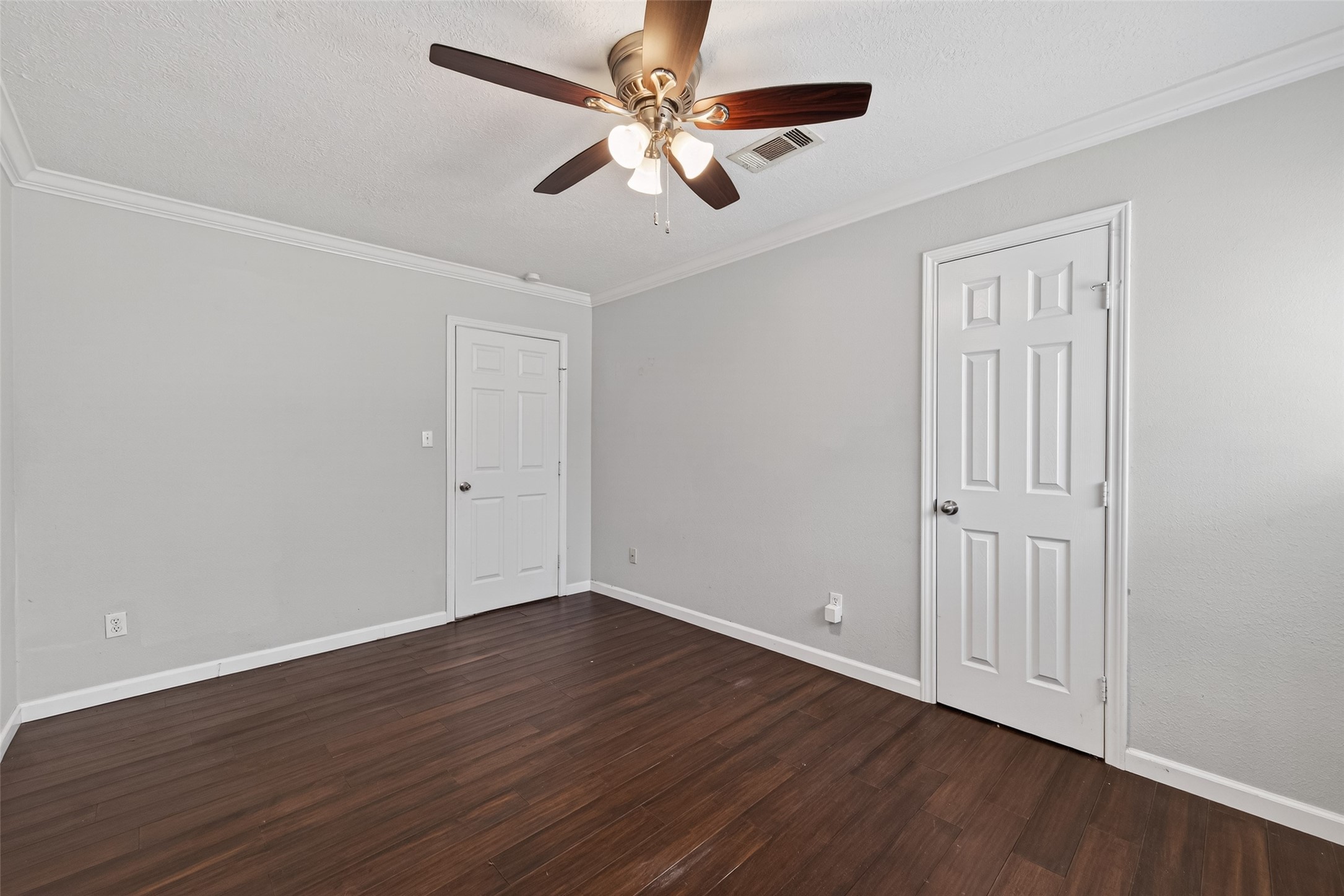 11811 Beverly Drive Houston, TX 77065 - Photo 28 of 48 a view of an empty room with wooden floor