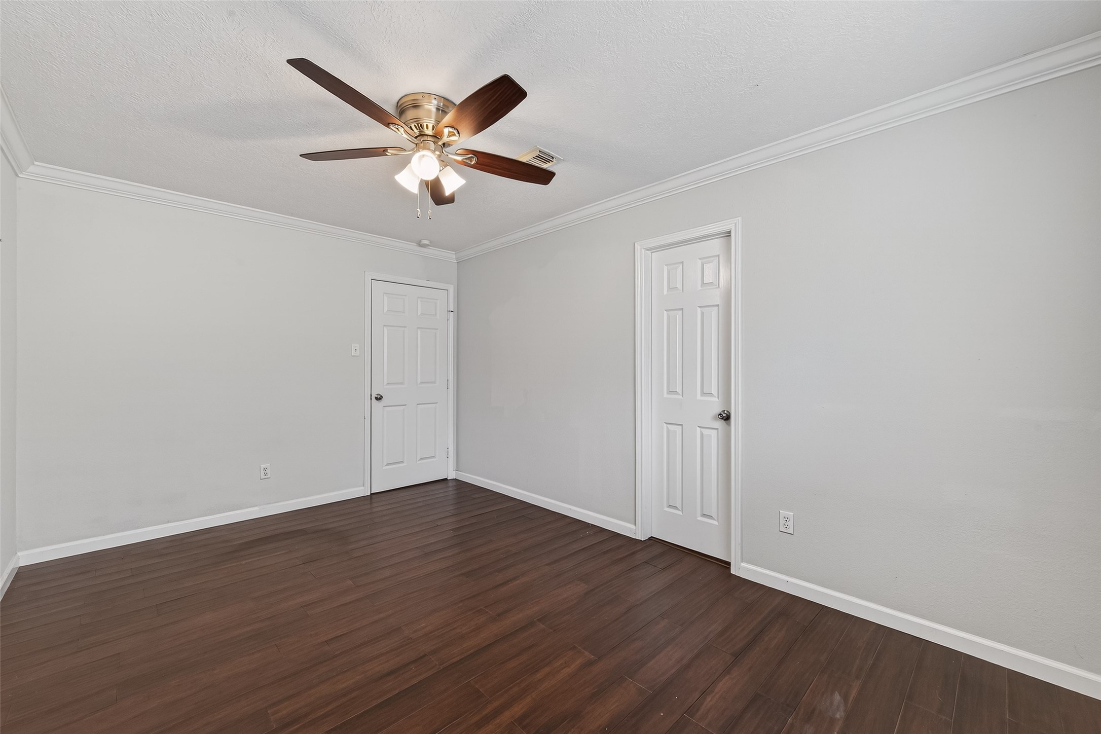 11811 Beverly Drive Houston, TX 77065 - Photo 30 of 48 a view of an empty room with wooden floor