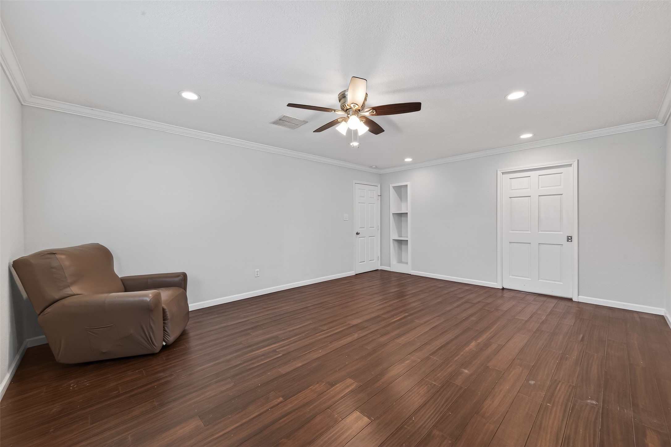 11811 Beverly Drive Houston, TX 77065 - Photo 37 of 48 a view of workspace room with wooden floor and ceiling fan