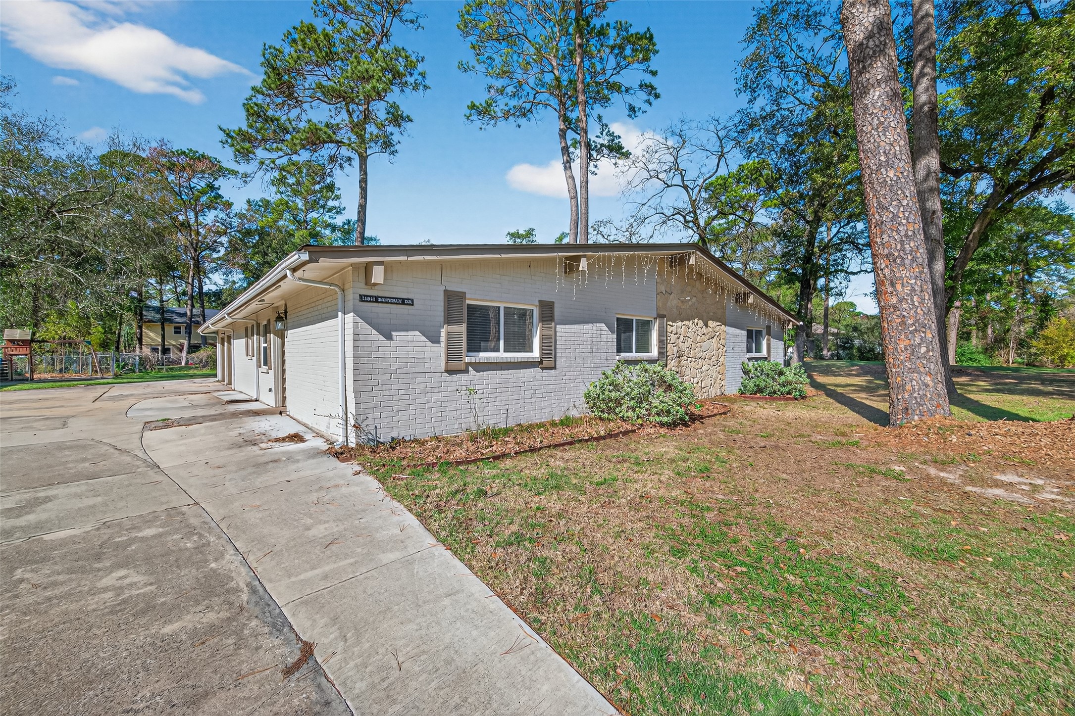 11811 Beverly Drive Houston, TX 77065 - Photo 4 of 48 a front view of a house with a yard and garage