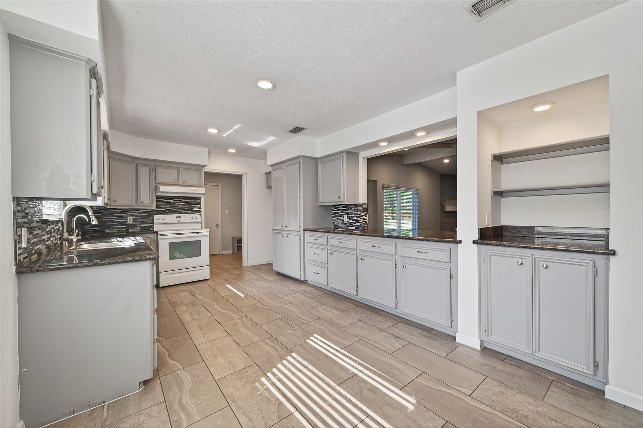 11811 Beverly Drive Houston, TX 77065 - Photo 9 of 48 a kitchen with stainless steel appliances granite countertop a refrigerator and a sink