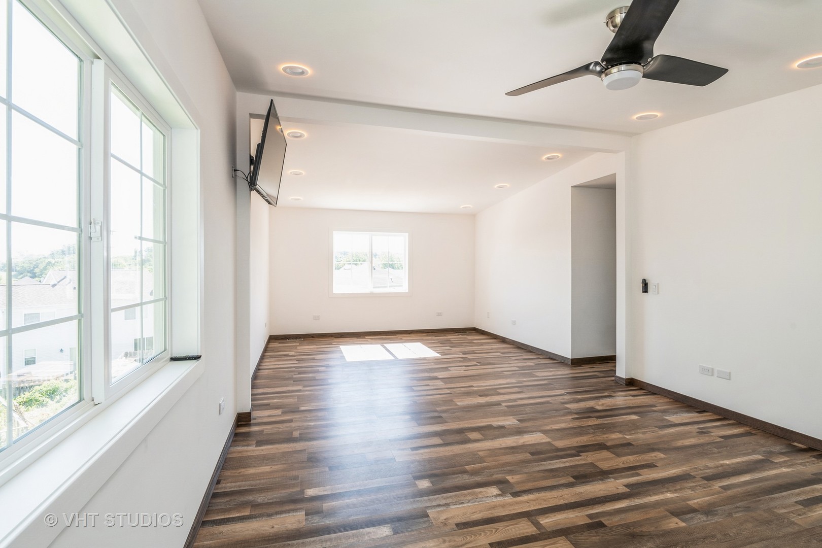 336 Oak Hill Court Antioch, IL 60002 - Photo 20 of 57 a view of an empty room with wooden floor and a window