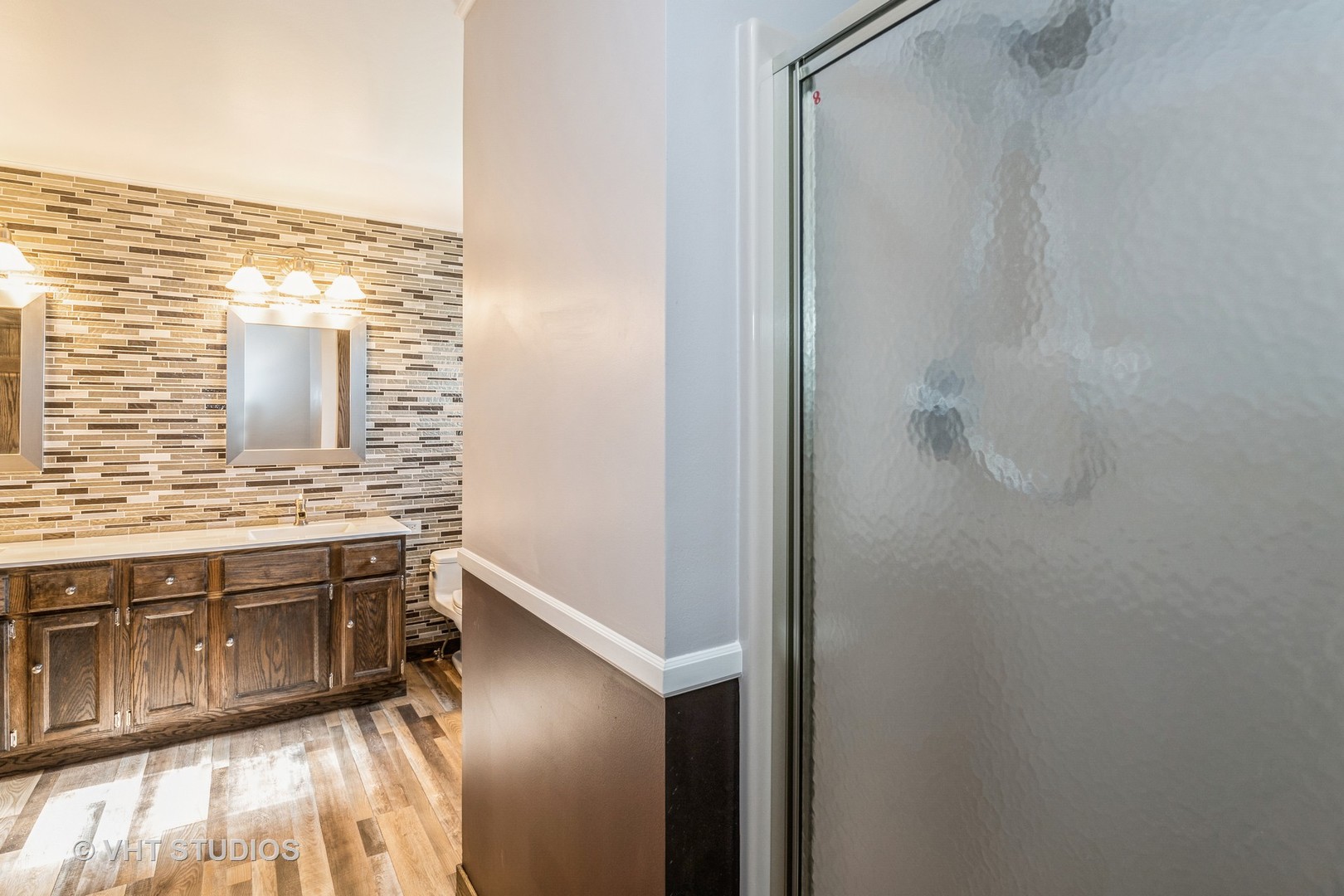 336 Oak Hill Court Antioch, IL 60002 - Photo 24 of 57 a bathroom with a granite countertop sink and a mirror