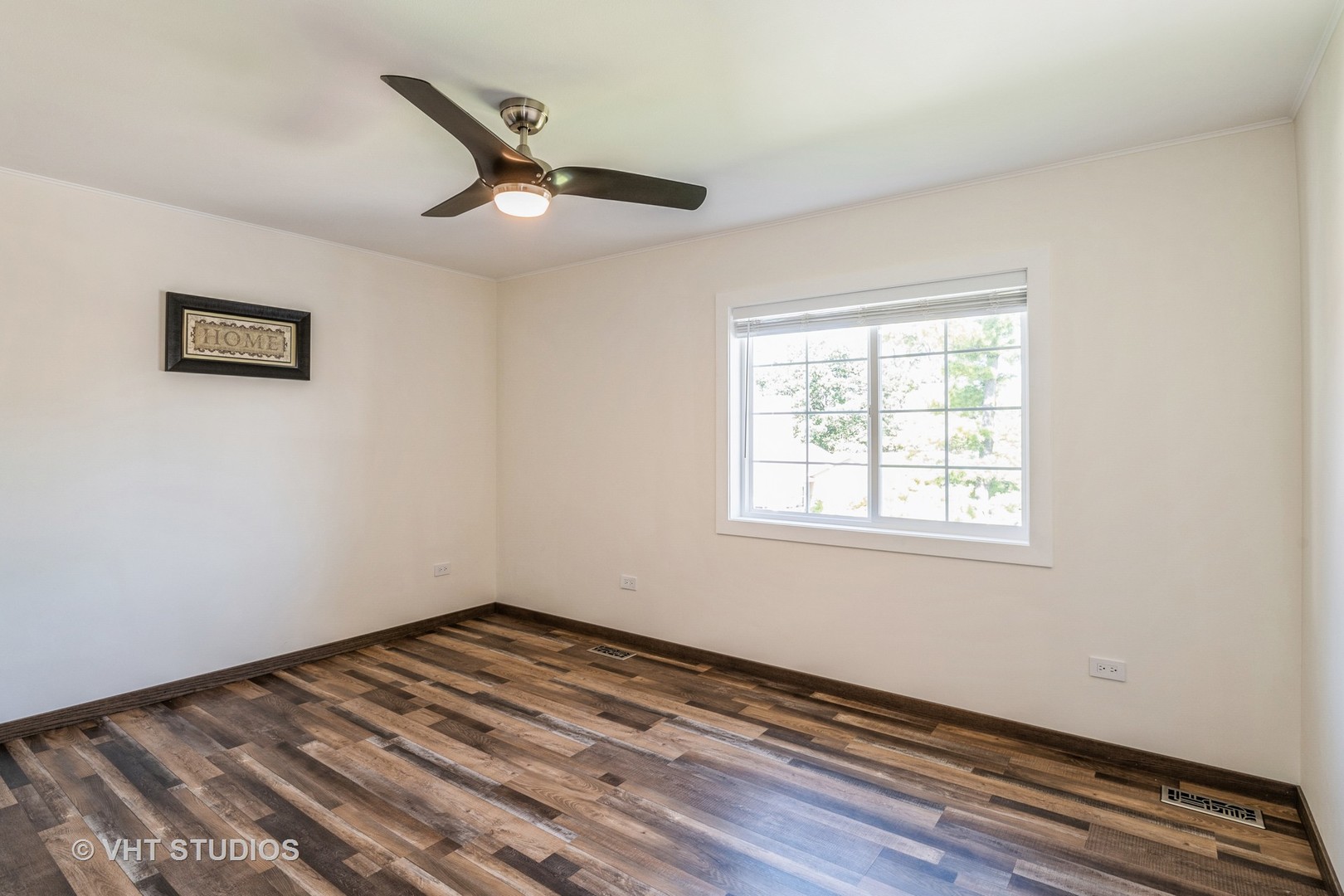 336 Oak Hill Court Antioch, IL 60002 - Photo 31 of 57 a view of a room with wooden floor and a window