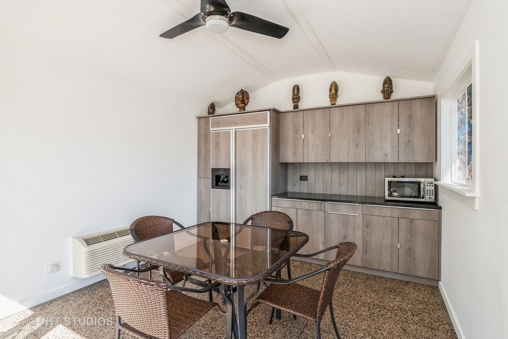 336 Oak Hill Court Antioch, IL 60002 - Photo 44 of 57 a kitchen with stainless steel appliances kitchen island granite countertop a table chairs in it and wooden floors