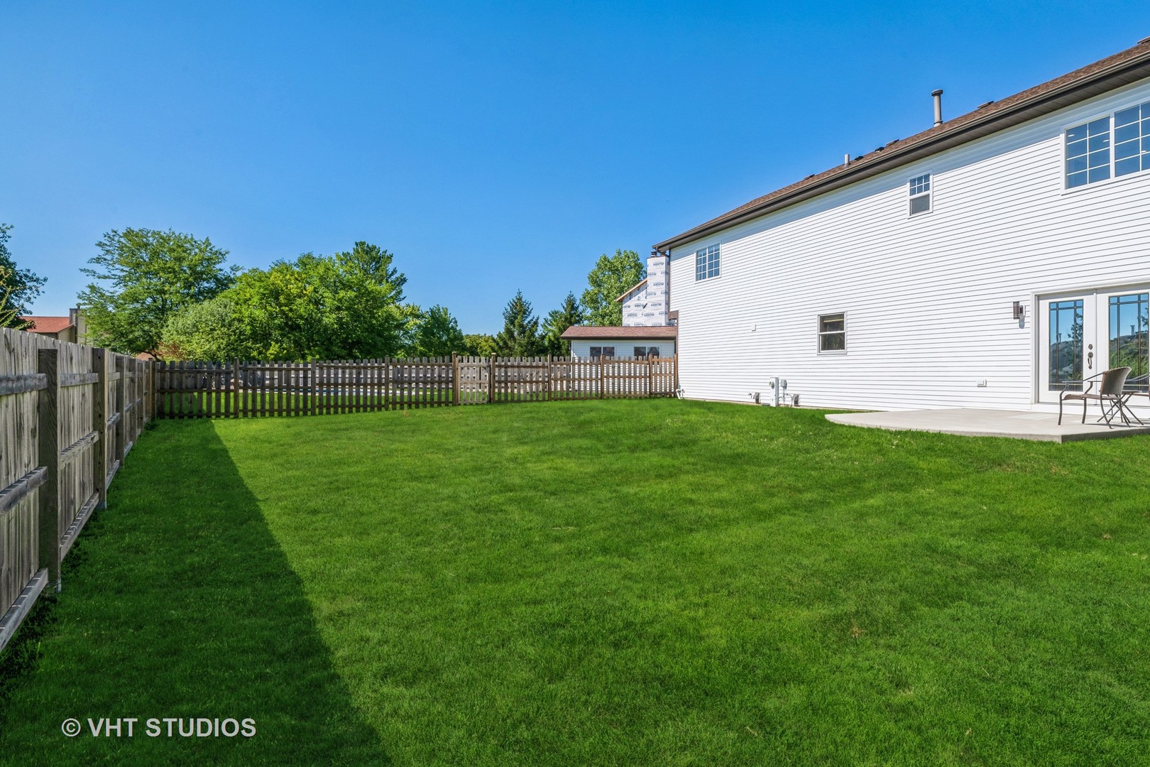 336 Oak Hill Court Antioch, IL 60002 - Photo 50 of 57 a view of a backyard with plants and a garden