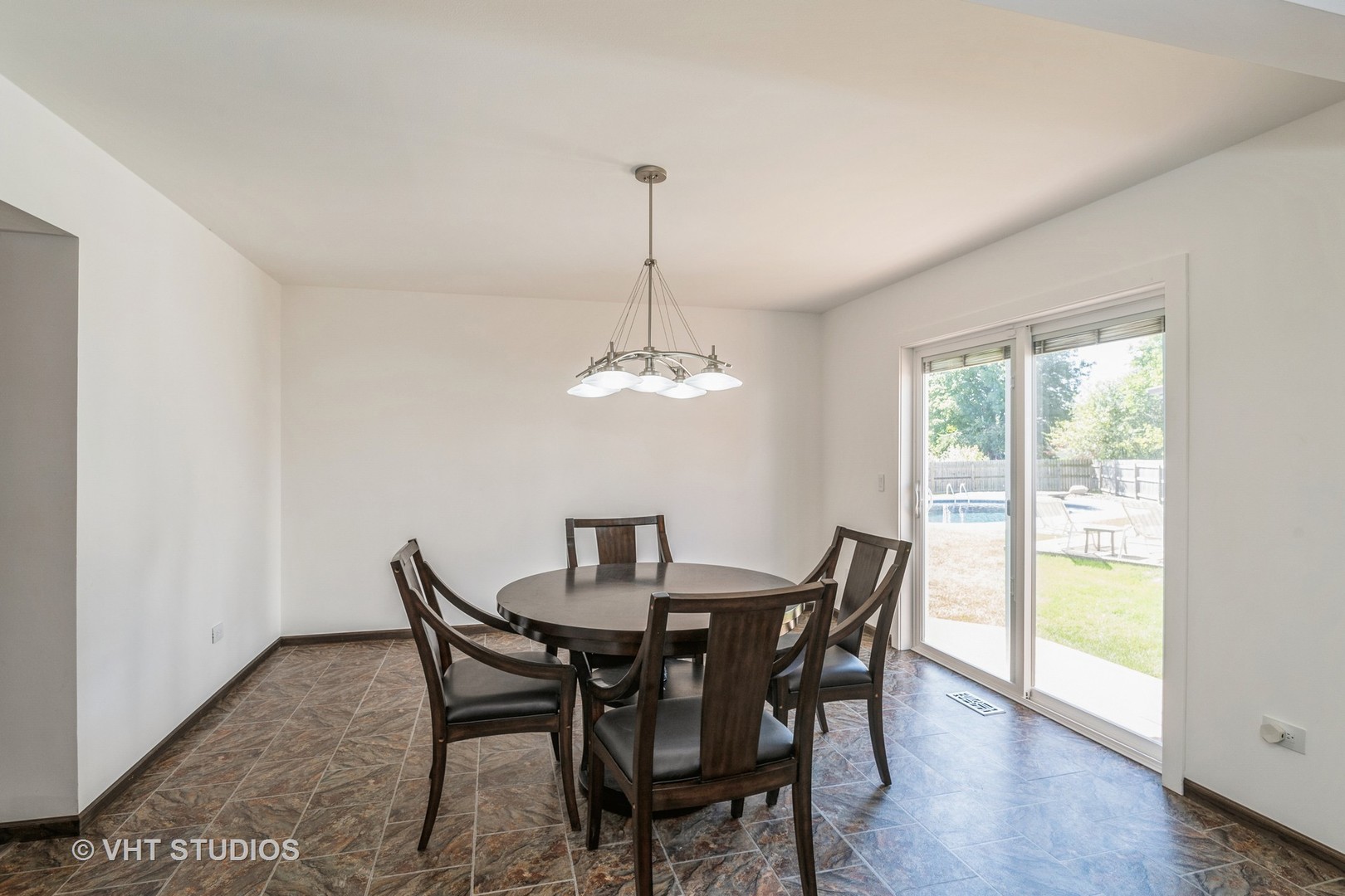 336 Oak Hill Court Antioch, IL 60002 - Photo 8 of 57 a dining room with furniture a chandelier and wooden floor