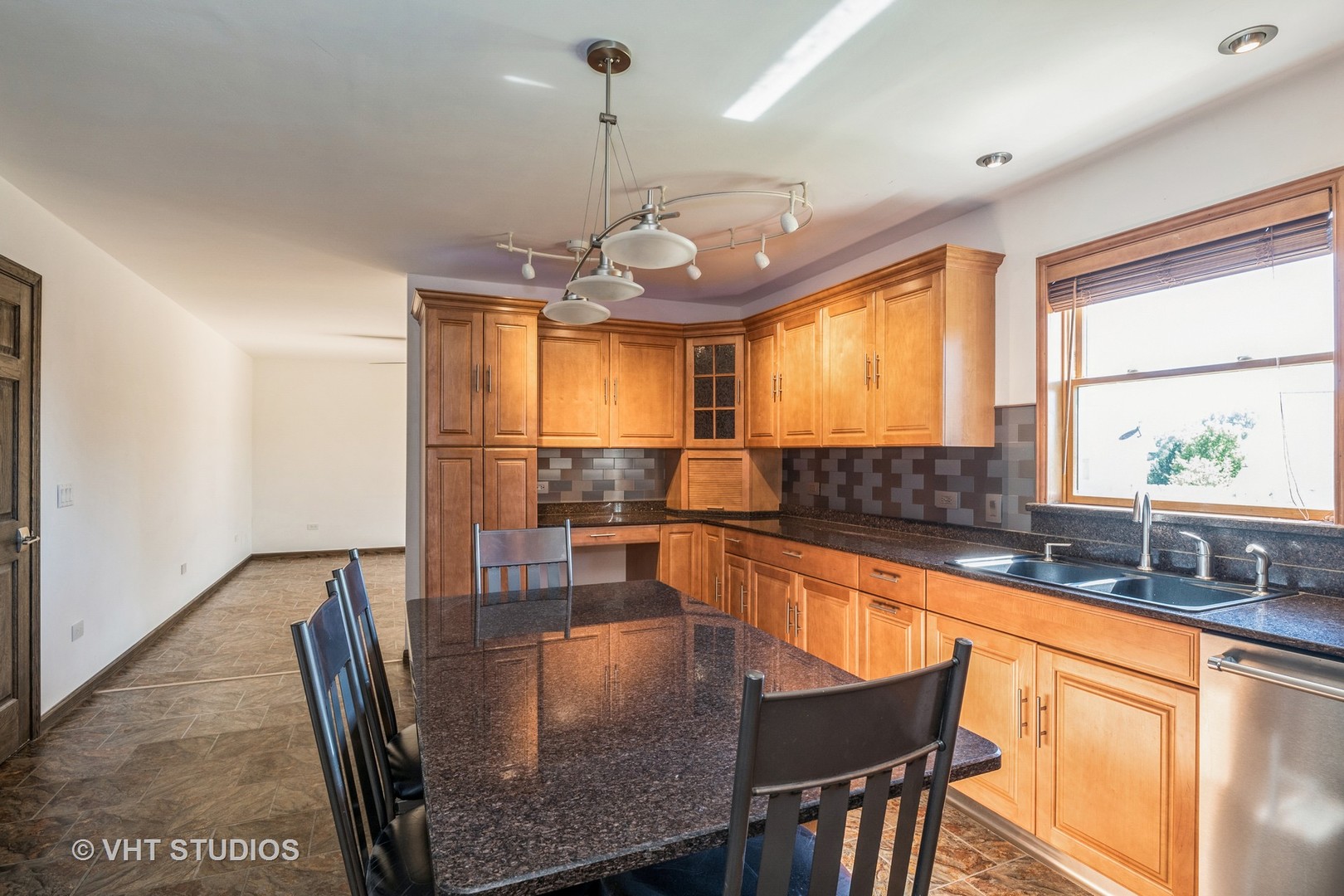 336 Oak Hill Court Antioch, IL 60002 - Photo 10 of 57 a kitchen with granite countertop a table chairs stove and granite counter top