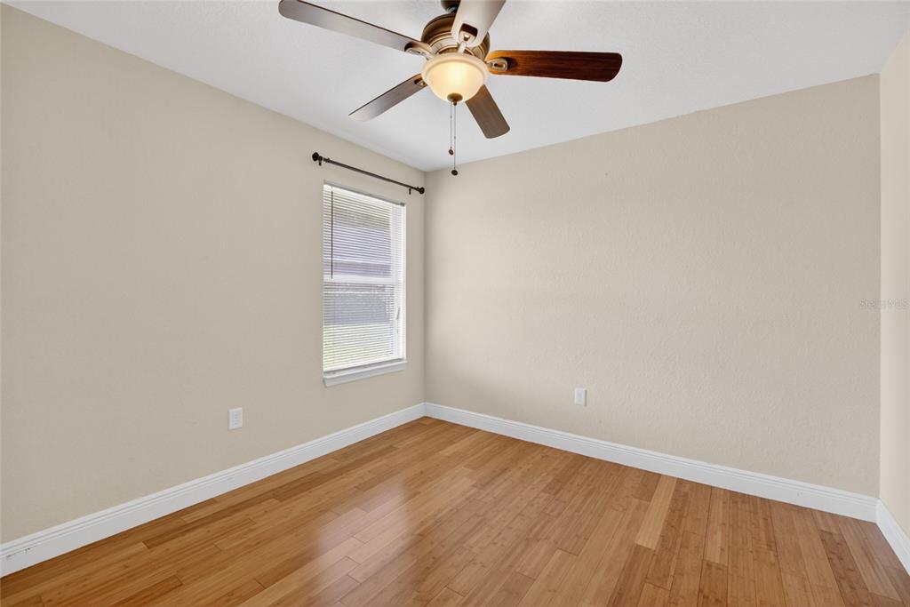 4319 Southwest 63rd Street Ocala, FL 34474 - Photo 19 of 29 a view of an empty room with window and wooden floor