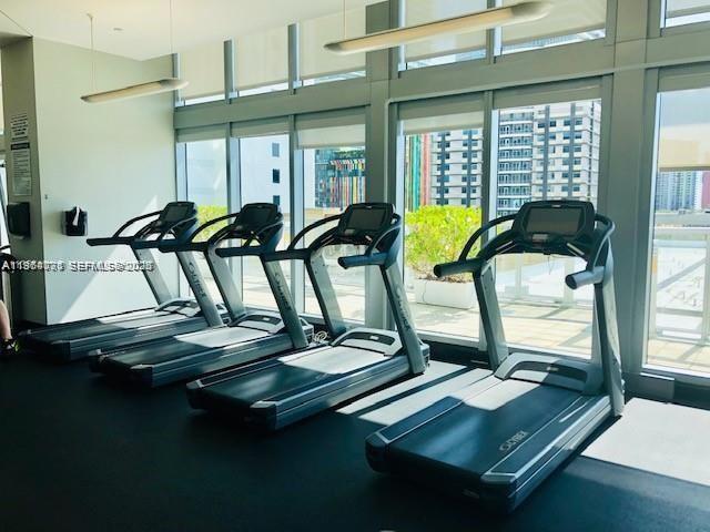 79 Southwest 12th Street, Unit 2402S Miami, FL 33130 - Photo 15 of 23 a view of a room with gym equipment