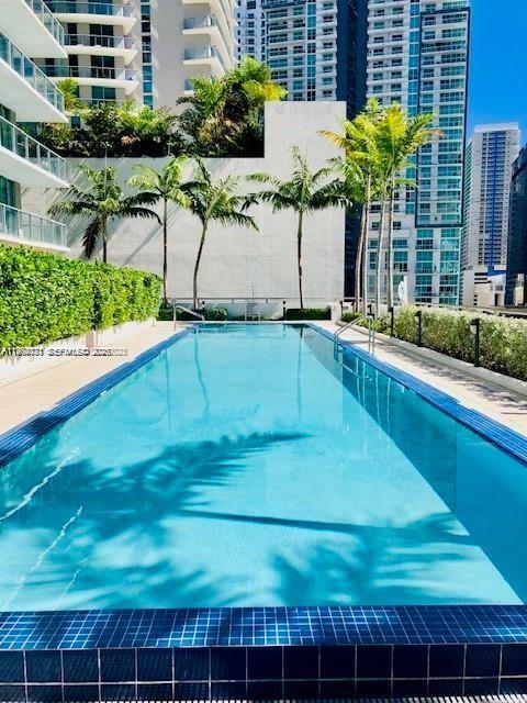 79 Southwest 12th Street, Unit 2402S Miami, FL 33130 - Photo 17 of 23 a house view with a swimming pool