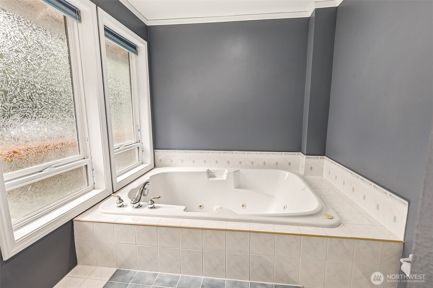 5815 95th Avenue Southwest Olympia, WA 98512 - Photo 11 of 26 a white bath tub sitting in a bathroom next to a window