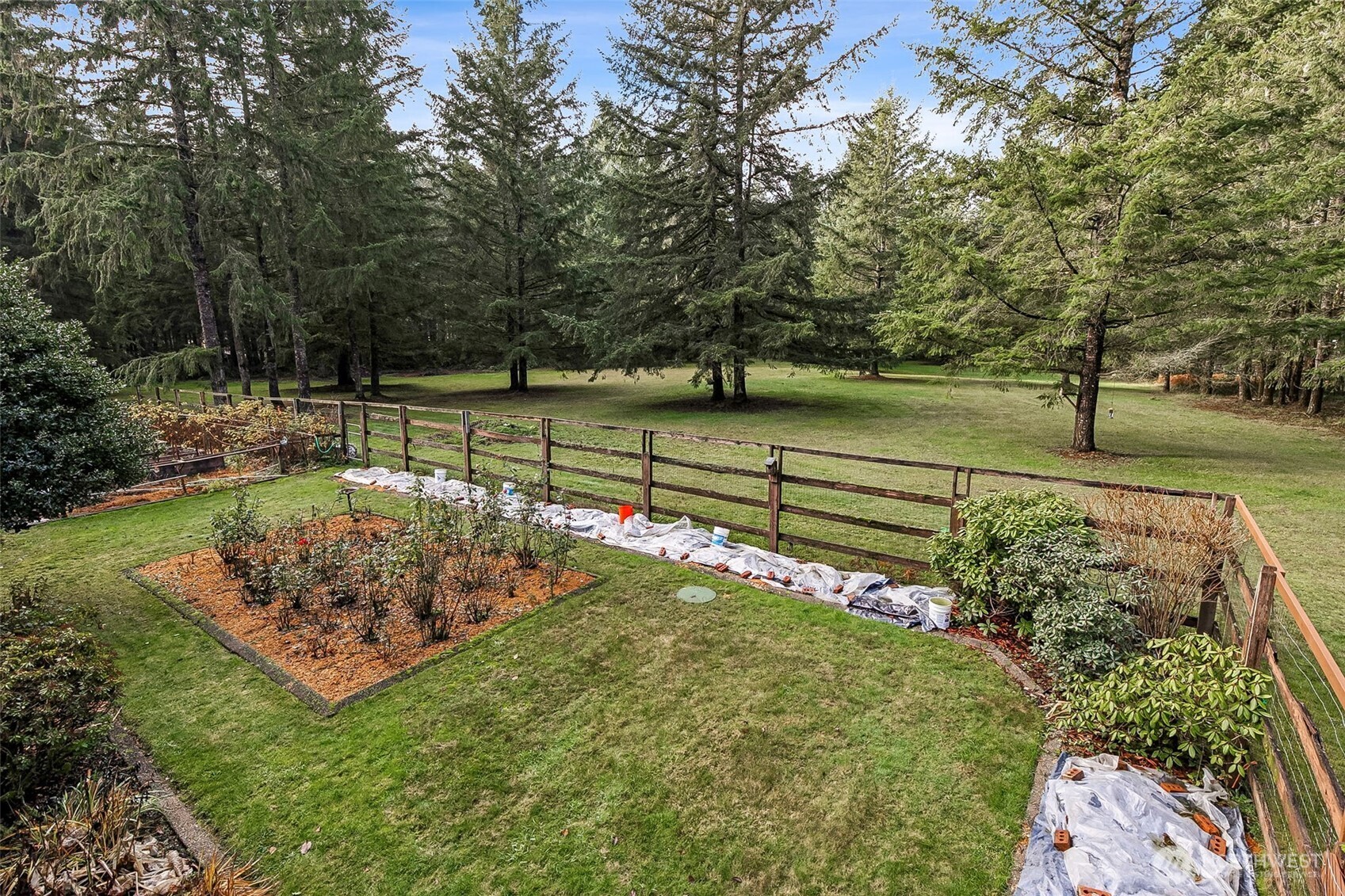 5815 95th Avenue Southwest Olympia, WA 98512 - Photo 14 of 26 a view of a backyard with wooden fence