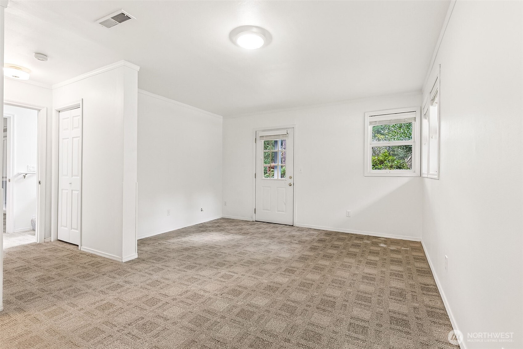 5815 95th Avenue Southwest Olympia, WA 98512 - Photo 17 of 26 an empty room with windows