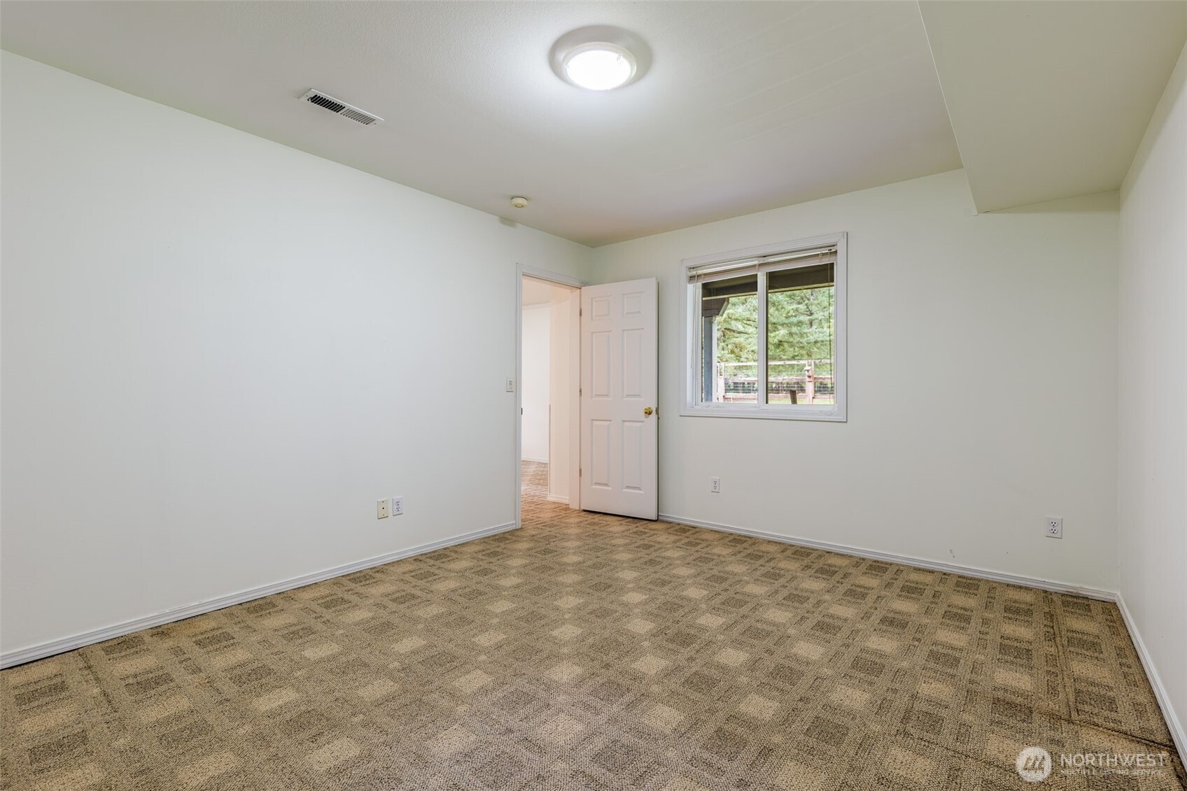 5815 95th Avenue Southwest Olympia, WA 98512 - Photo 19 of 26 an empty room with windows