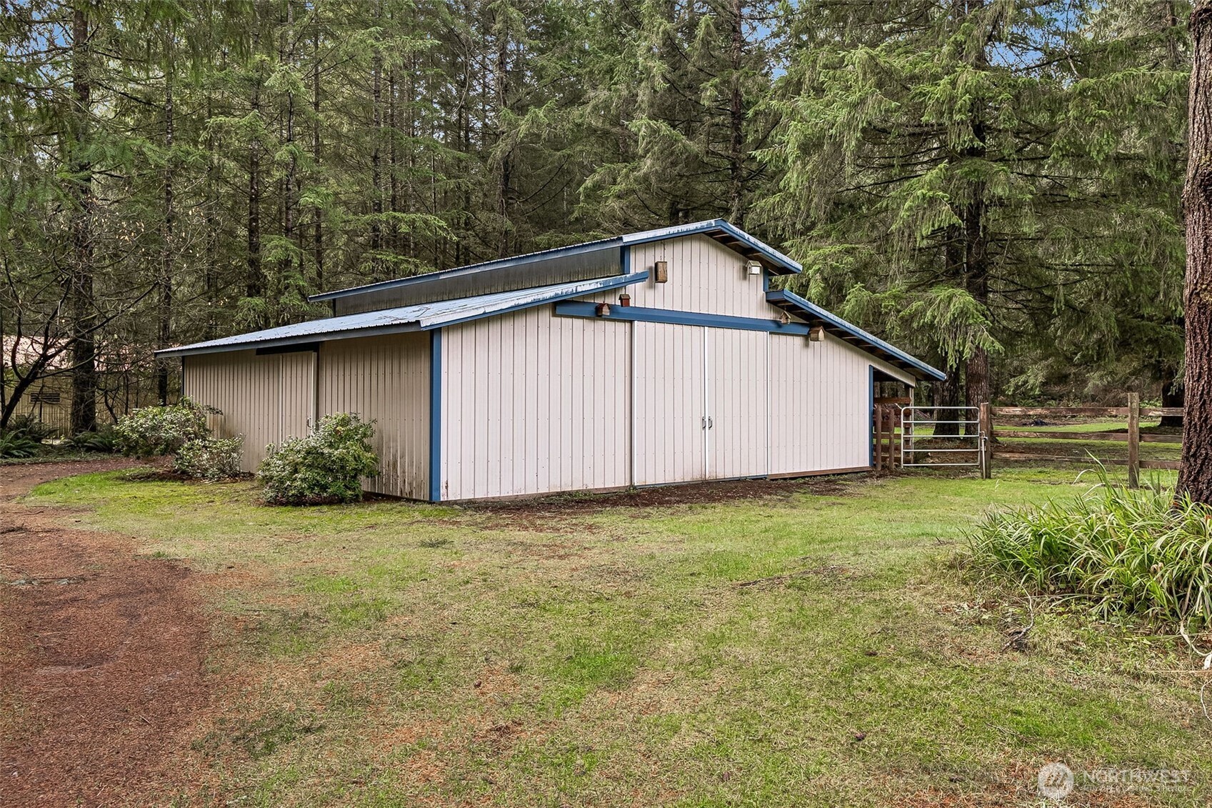 5815 95th Avenue Southwest Olympia, WA 98512 - Photo 22 of 26 a view of a backyard with potted plants and large tree