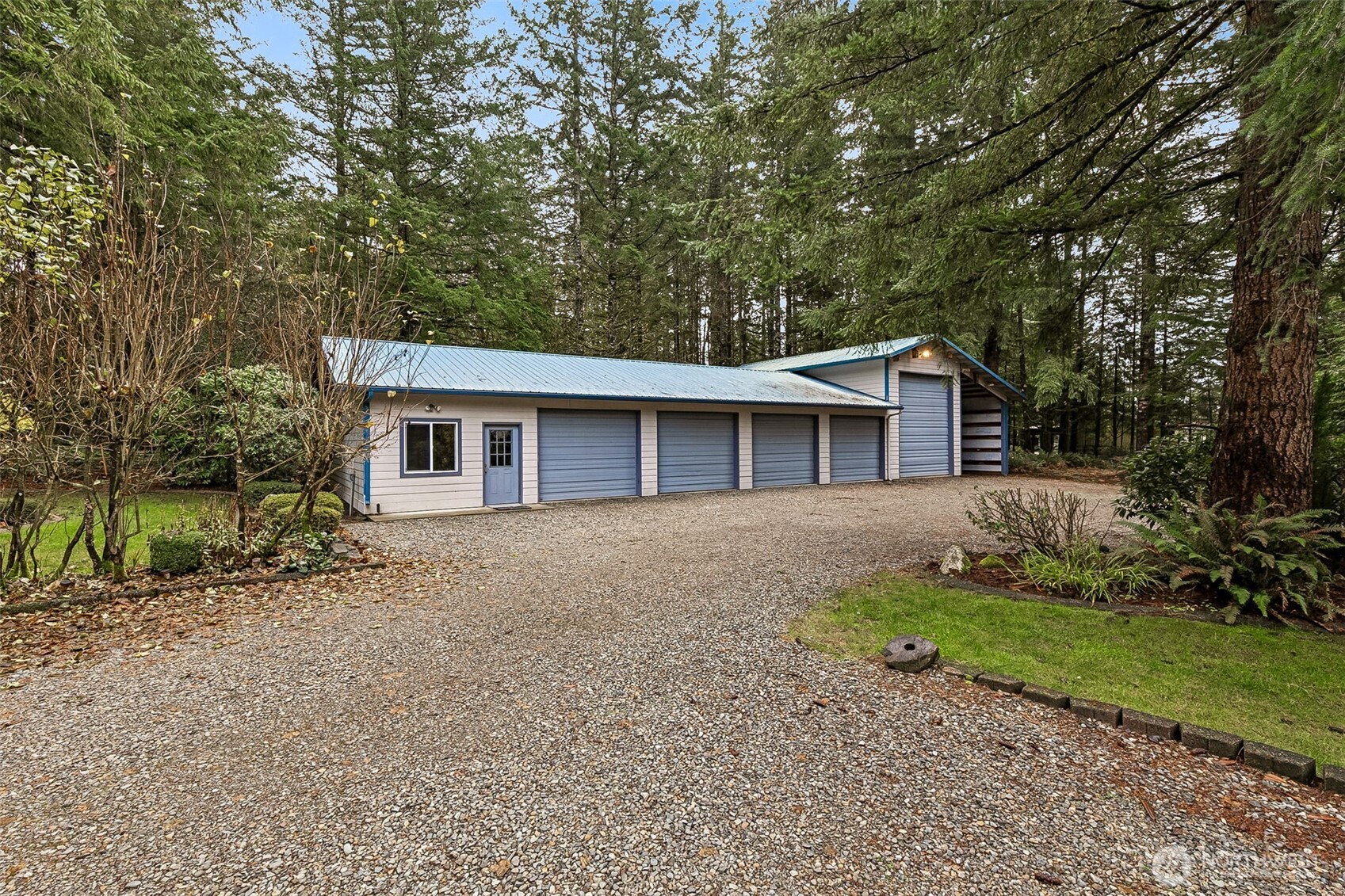 5815 95th Avenue Southwest Olympia, WA 98512 - Photo 24 of 26 a front view of a house with a garden