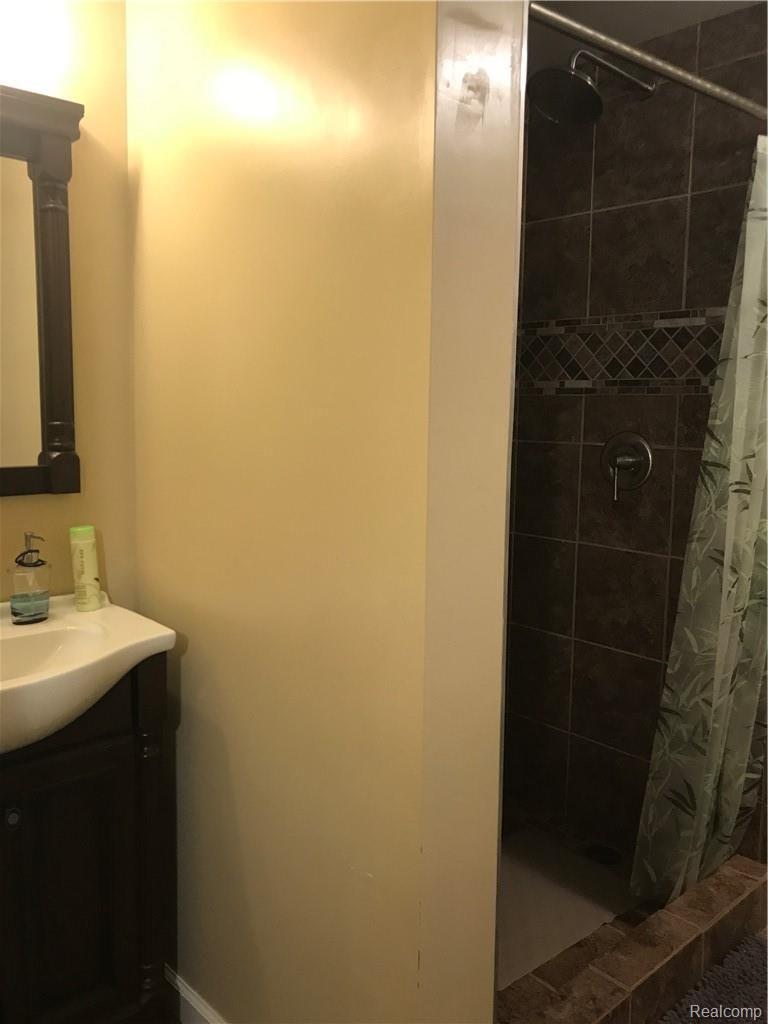 7582 West Beard Road Perry, MI 48872 - Photo 26 of 35 Nicely done bath in basement, another ceramic shower and floor!