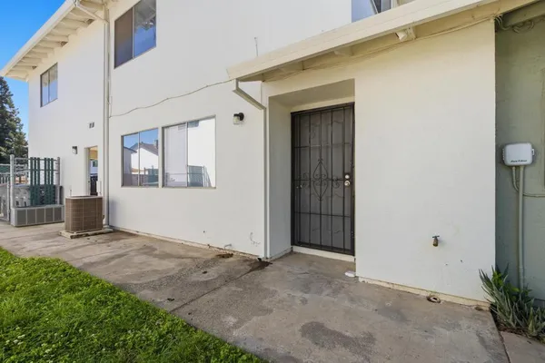a kitchen with stainless steel appliances kitchen island sink refrigerator and stove