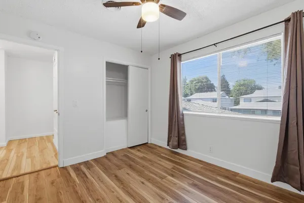 wooden floor in kitchen with a sink