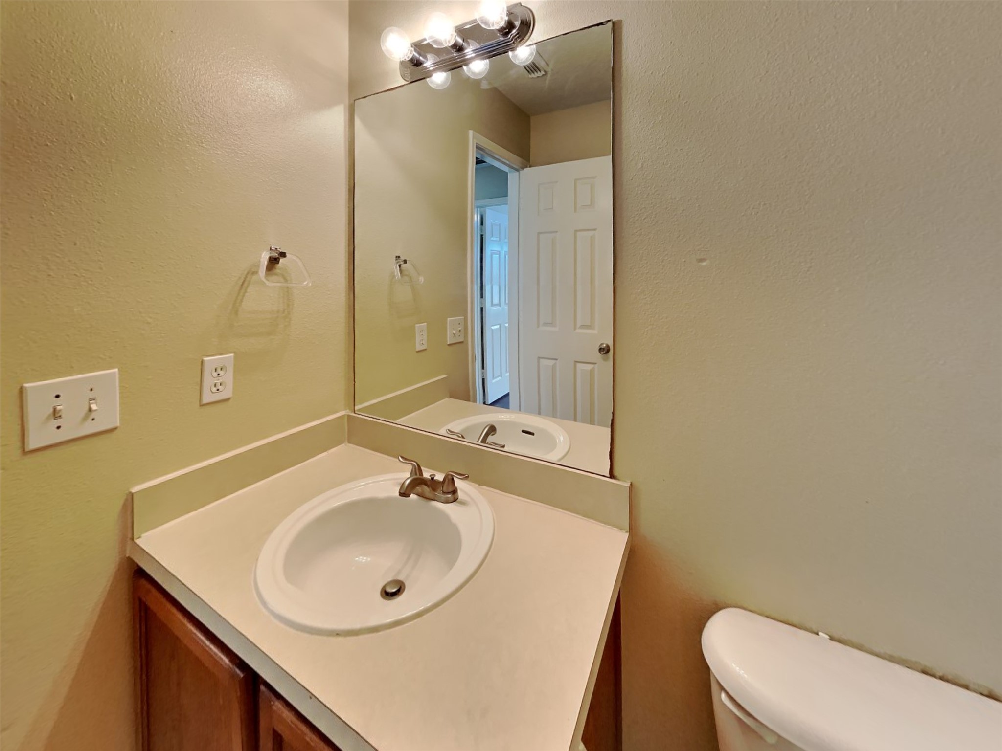 18322 Valiant Brook Court Humble, TX 77346 - Photo 14 of 20 a bathroom with a sink a toilet and mirror