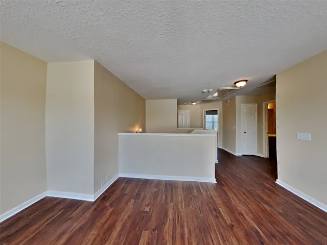 a view of kitchen with wooden floor and electronic appliances