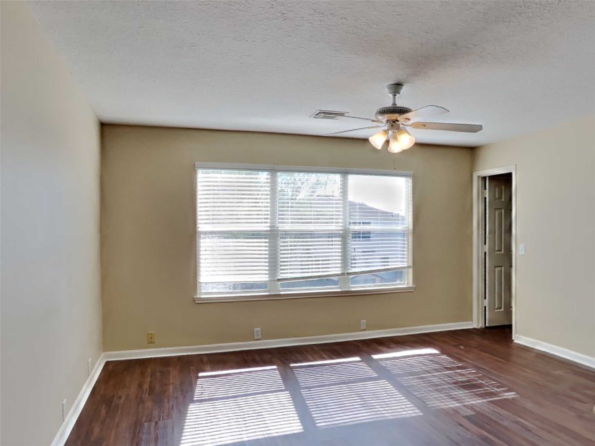 18322 Valiant Brook Court Humble, TX 77346 - Photo 19 of 20 an empty room with wooden floor and windows