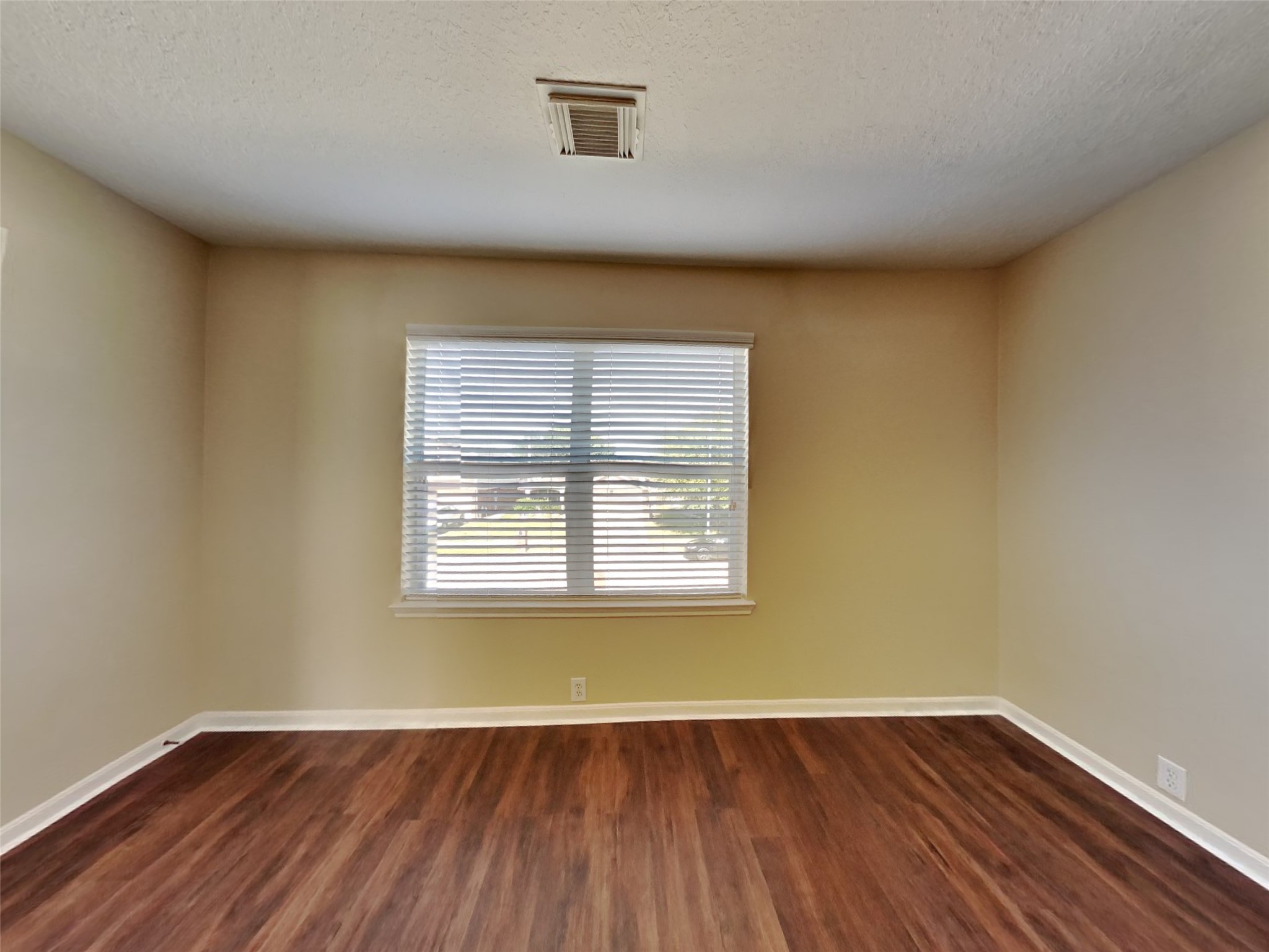18322 Valiant Brook Court Humble, TX 77346 - Photo 10 of 20 an empty room with wooden floor and windows