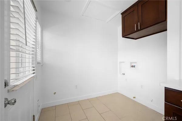 a view of a microwave and cabinets