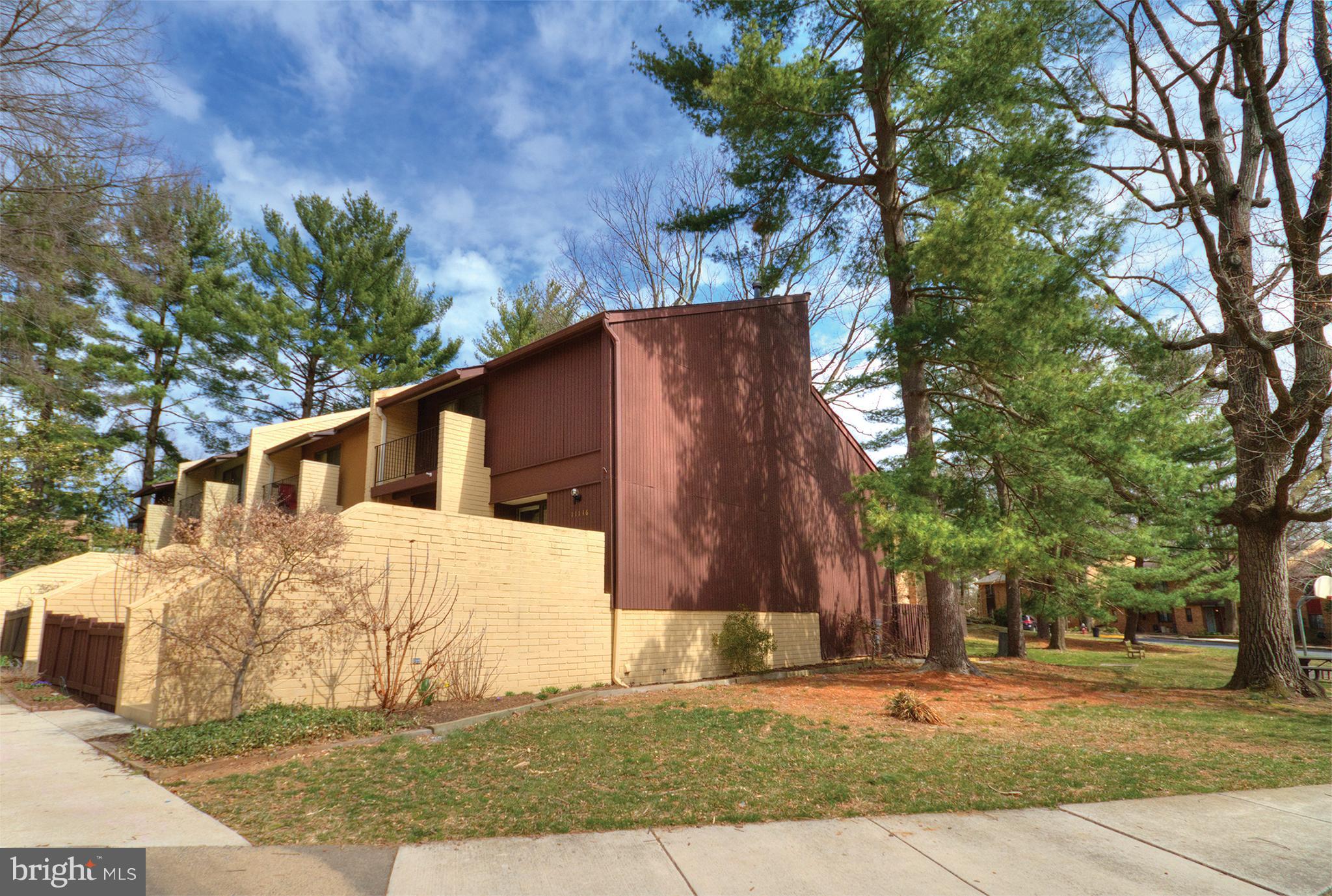 11116 Saffold Way Reston, VA 20190 - Photo 1 of 30 a view of a house with a yard