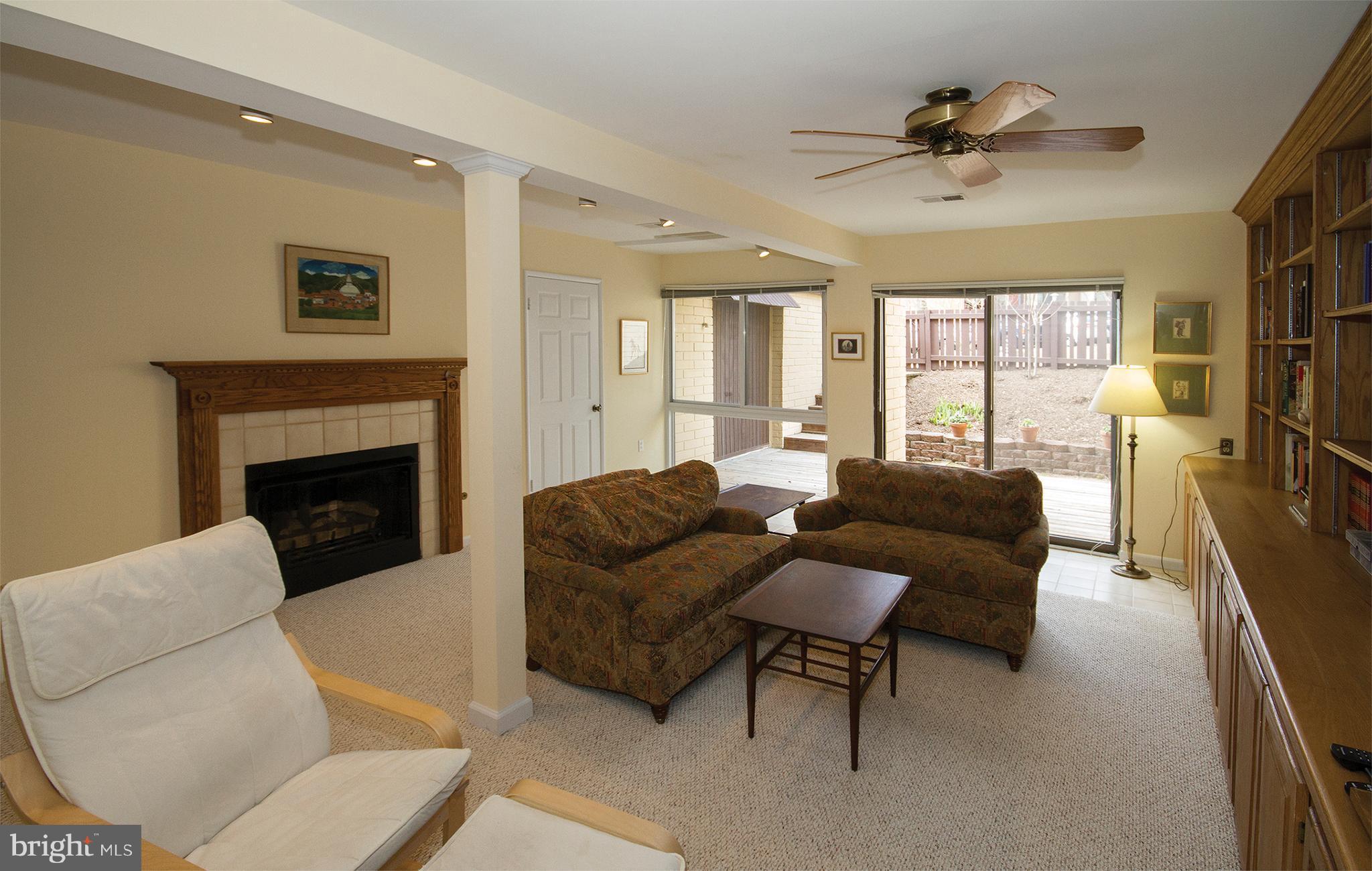 11116 Saffold Way Reston, VA 20190 - Photo 14 of 30 a living room with furniture and a fireplace