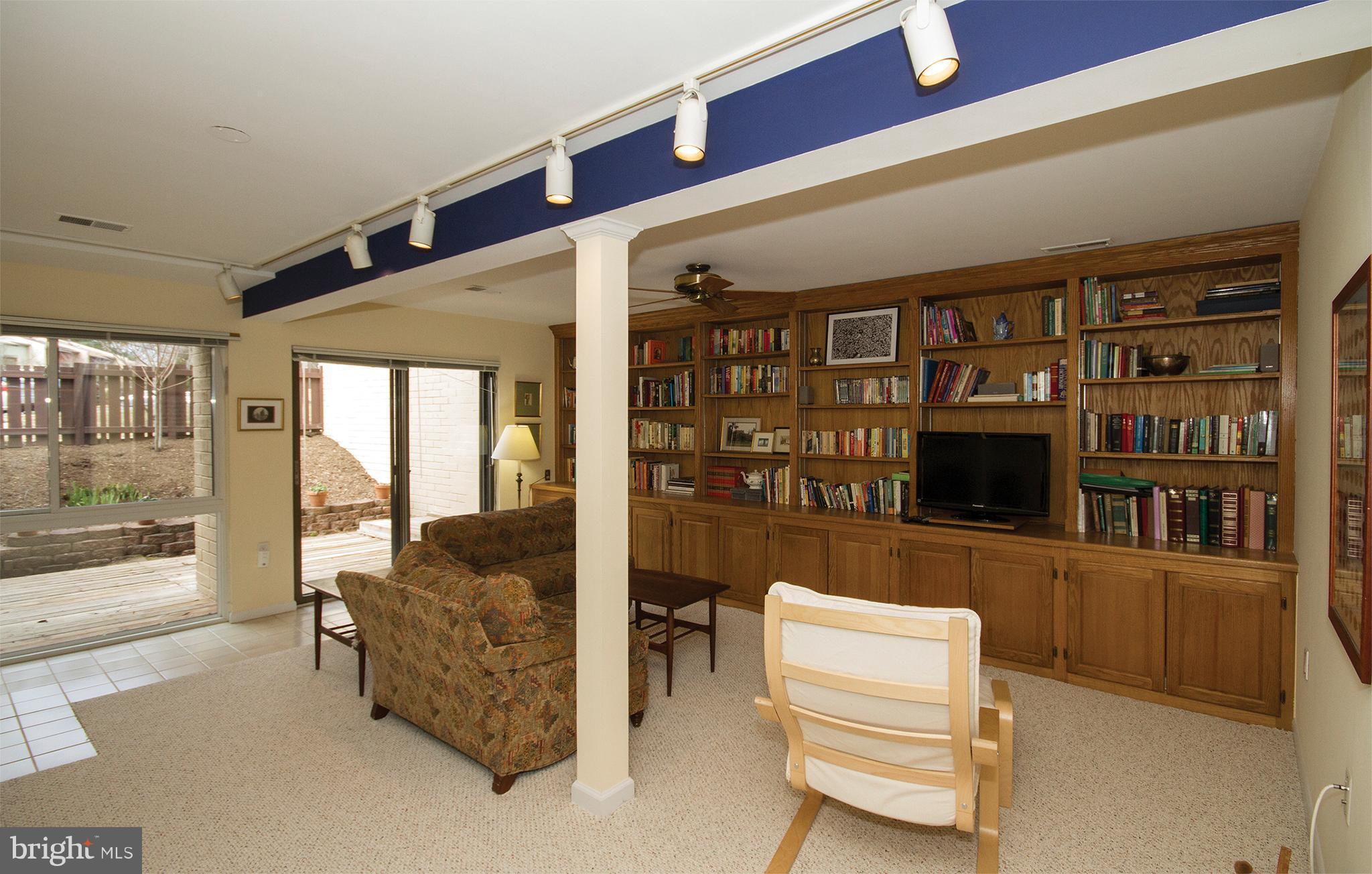 11116 Saffold Way Reston, VA 20190 - Photo 15 of 30 a living room with furniture and a flat screen tv
