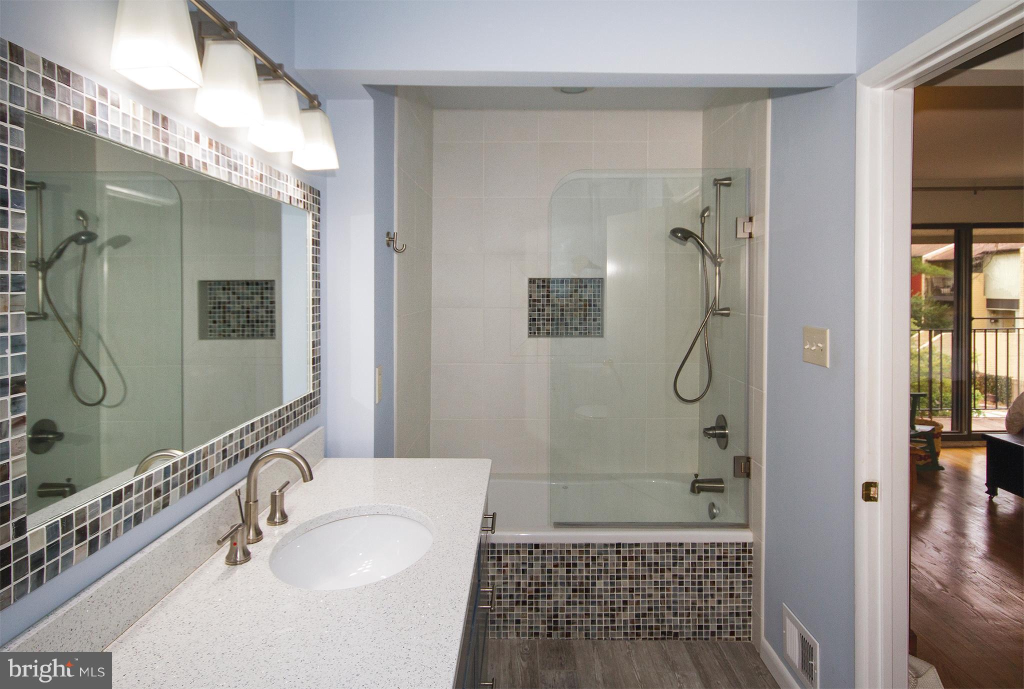 11116 Saffold Way Reston, VA 20190 - Photo 25 of 30 a bathroom with a shower