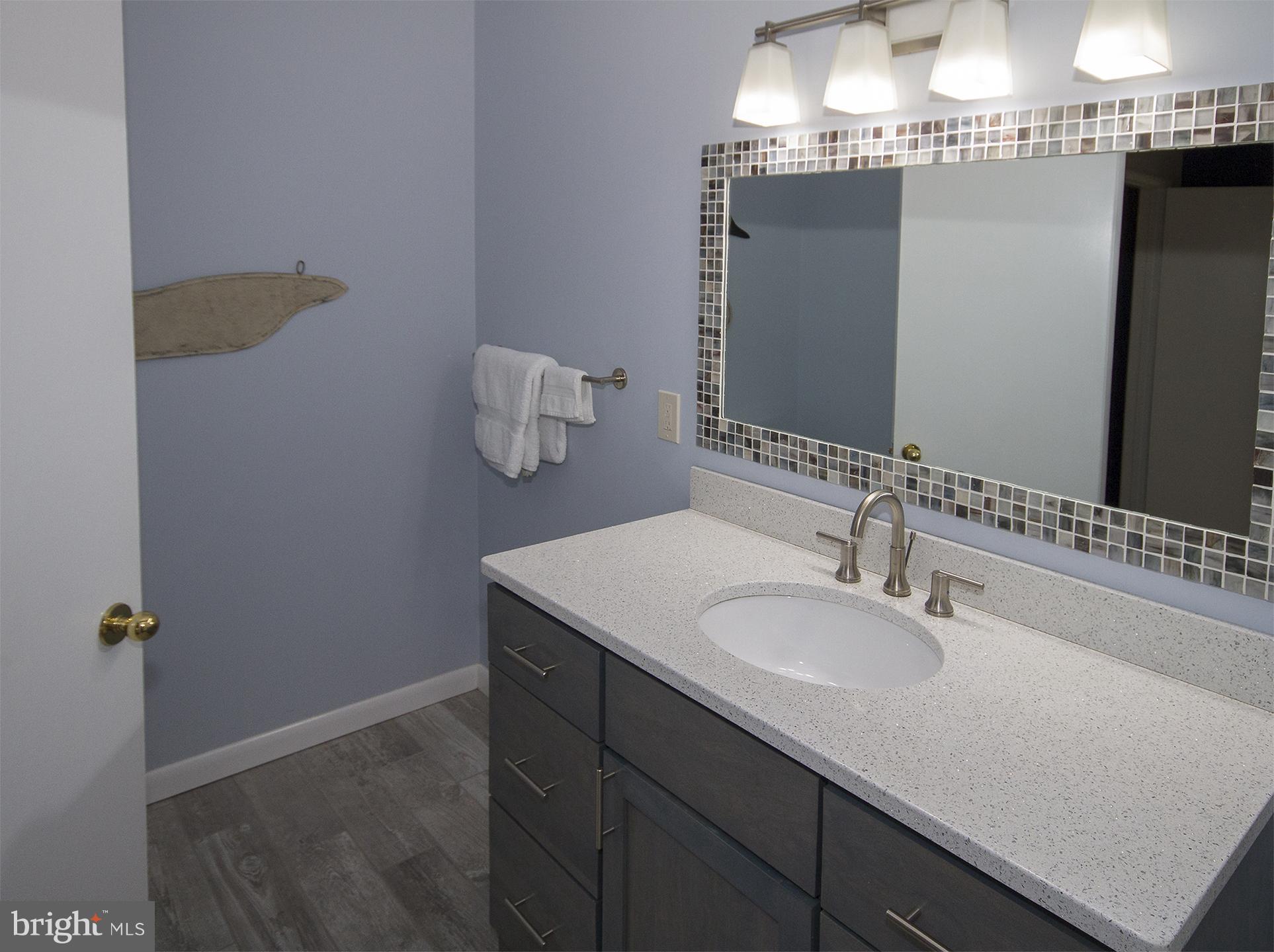 11116 Saffold Way Reston, VA 20190 - Photo 26 of 30 a bathroom with a sink and a mirror