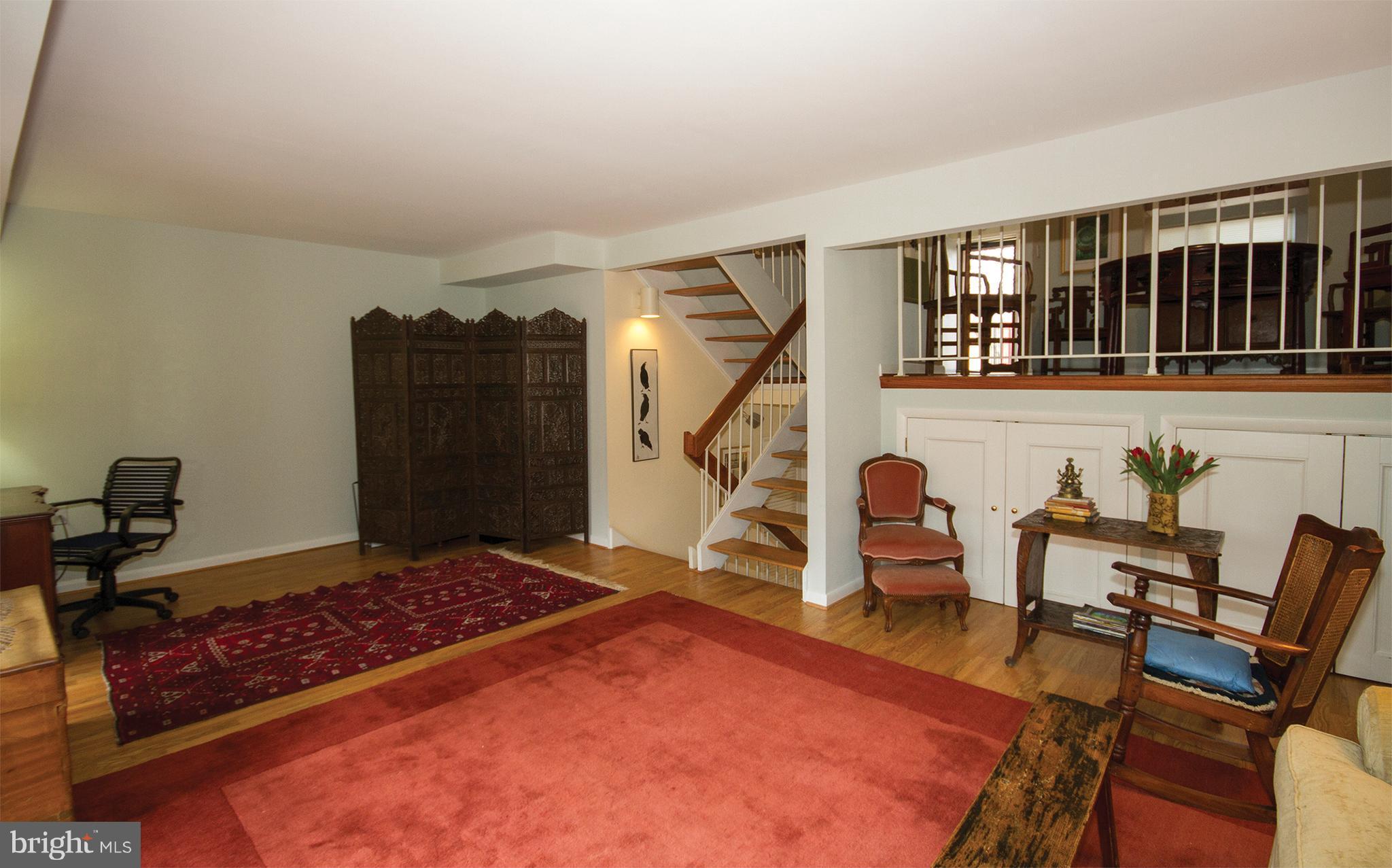 11116 Saffold Way Reston, VA 20190 - Photo 9 of 30 a living room with furniture rug and a table