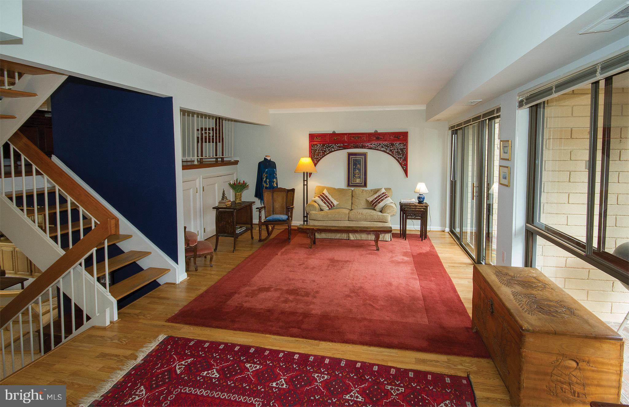 11116 Saffold Way Reston, VA 20190 - Photo 10 of 30 a living room with furniture and a wooden floor