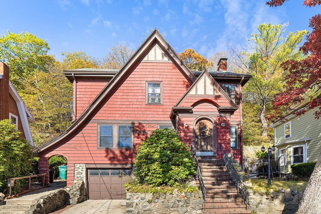 a front view of a house with garden