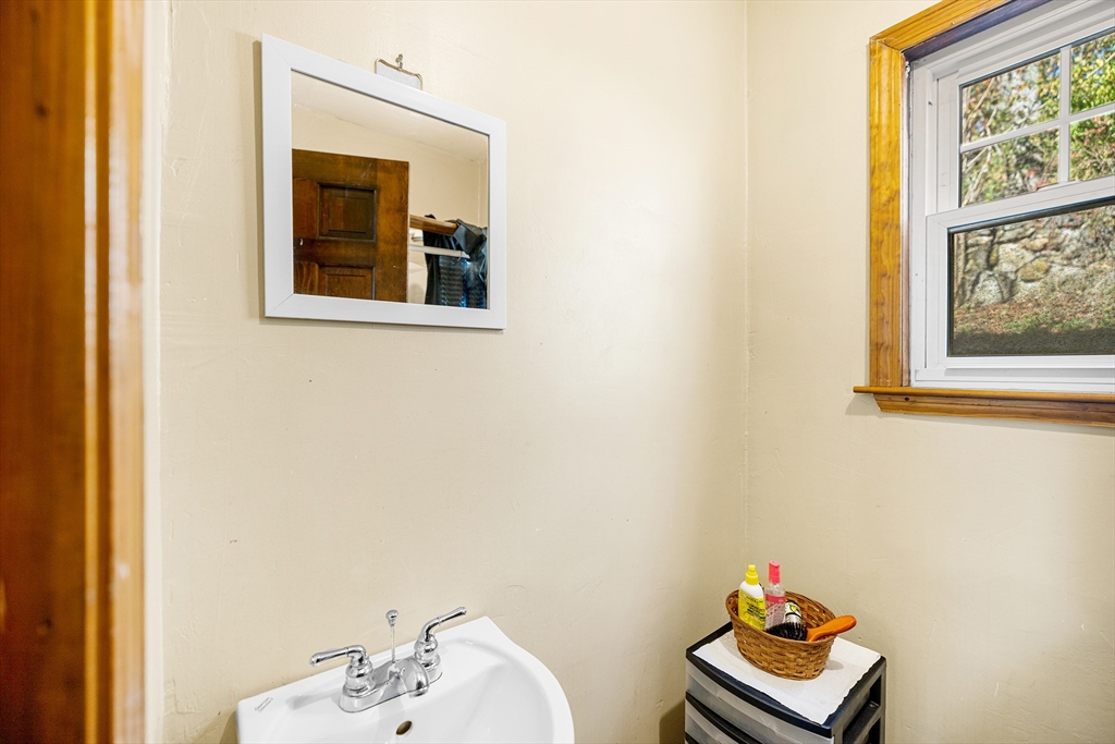 11 Linwood Road Lynn, MA 01905 - Photo 11 of 25 a bathroom with a toilet sink and mirror