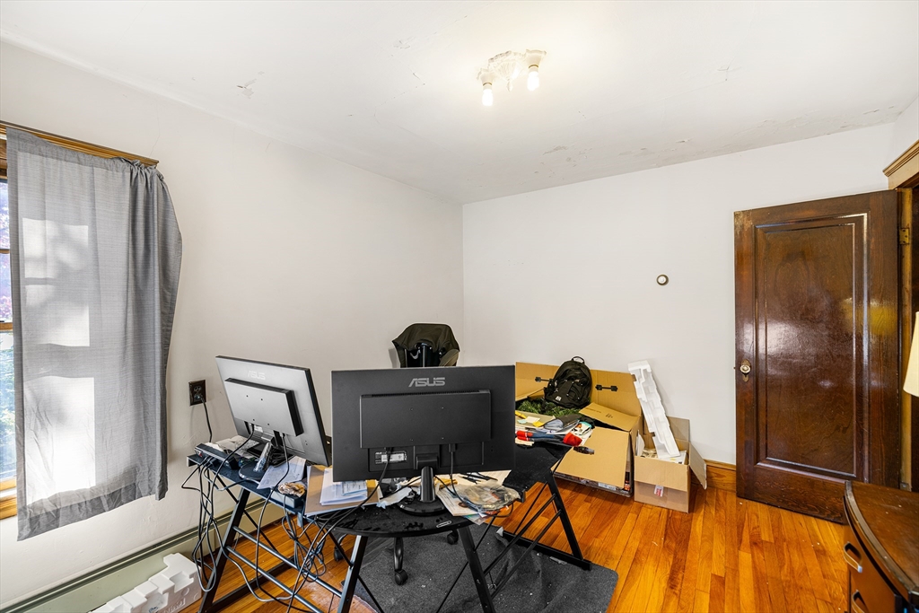11 Linwood Road Lynn, MA 01905 - Photo 13 of 25 a view of a workspace with furniture and a window