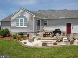 2 Mt Pleasant Road Willards, MD 21874 - Photo 2 of 8 a front view of a house with a garden and patio