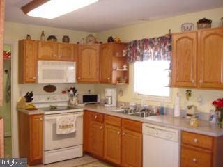 2 Mt Pleasant Road Willards, MD 21874 - Photo 5 of 8 a kitchen with stainless steel appliances a sink a stove and cabinets