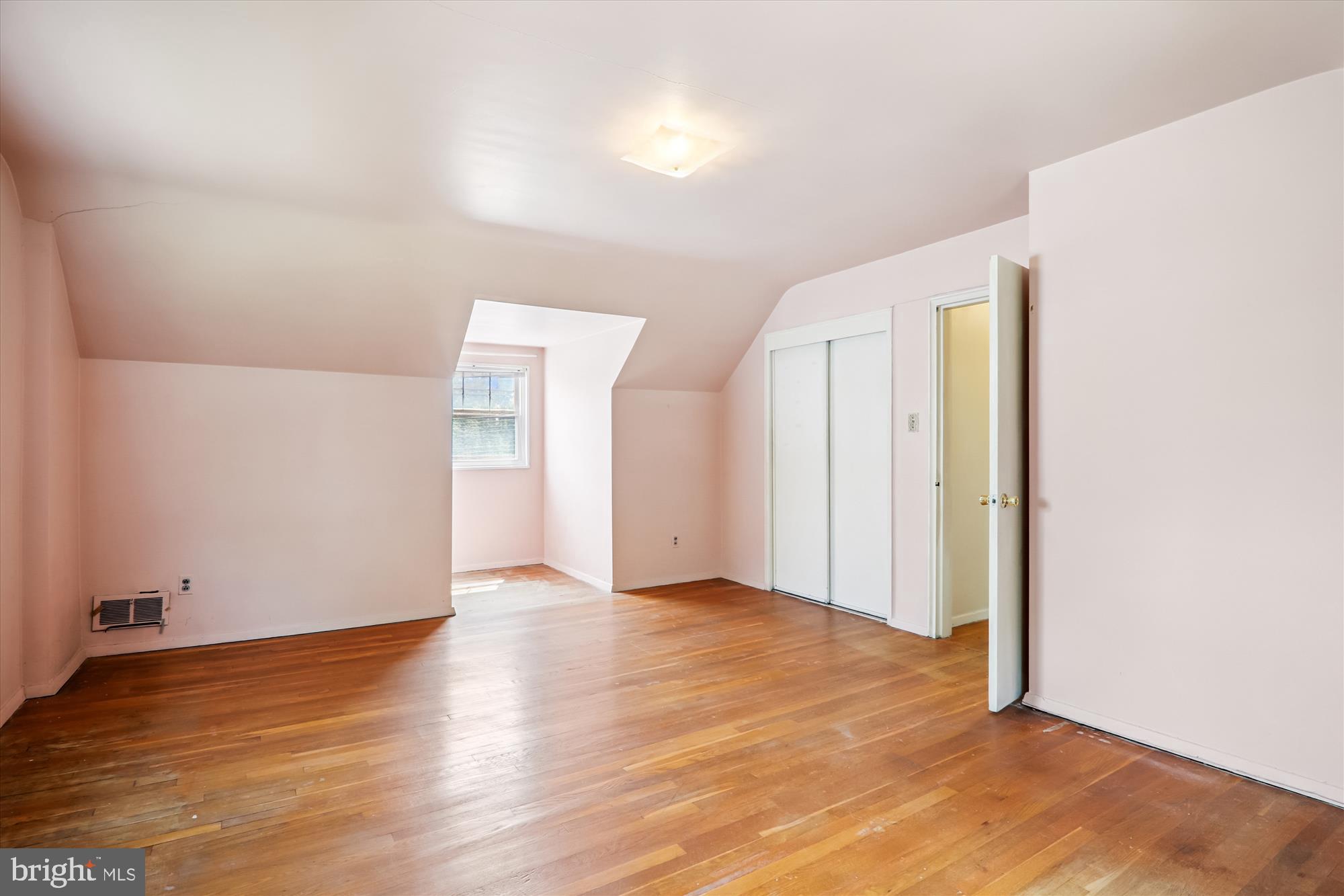 9507 Adelphi Road Silver Spring, MD 20903 - Photo 30 of 41 a view of an empty room with wooden floor
