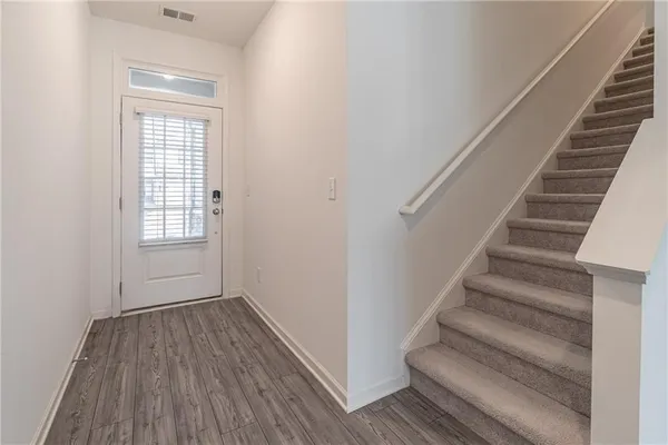 a view of entryway with wooden floor