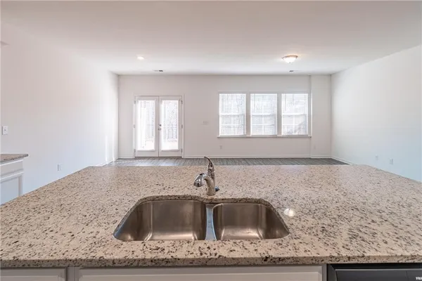 a kitchen with granite countertop a sink and a granite counter tops