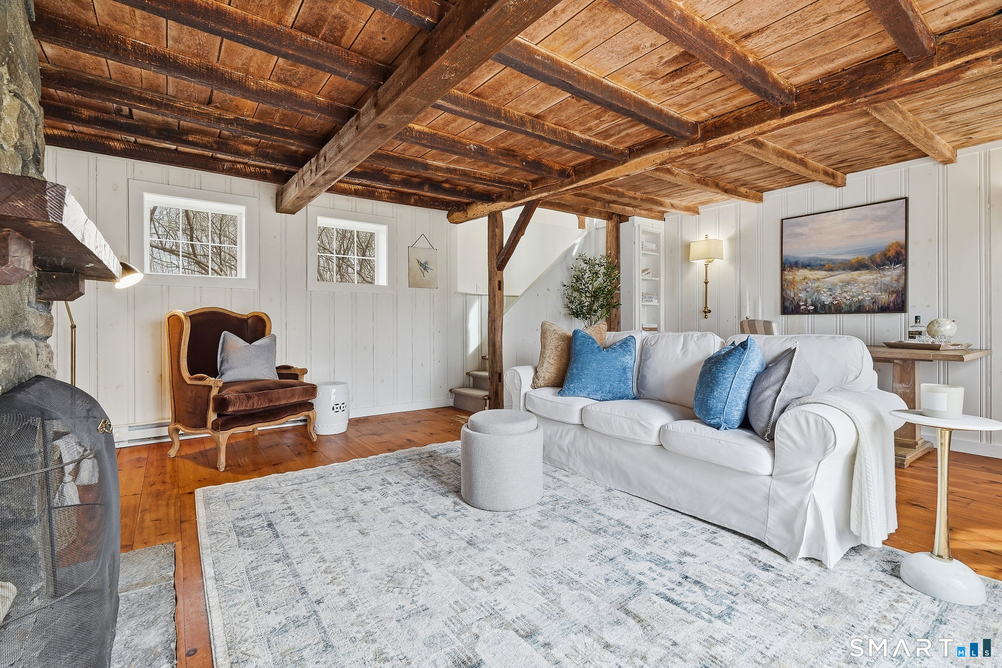 134 Sterling City Road Lyme, CT 06371 - Photo 12 of 38 The exposed wood ceiling in the family room brings natural beauty and texture overhead.