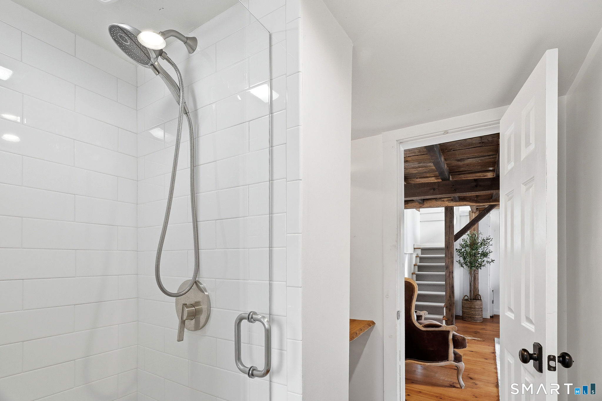 134 Sterling City Road Lyme, CT 06371 - Photo 17 of 38 A thoughtfully updated full bathroom on the main level showcases a tiled shower.