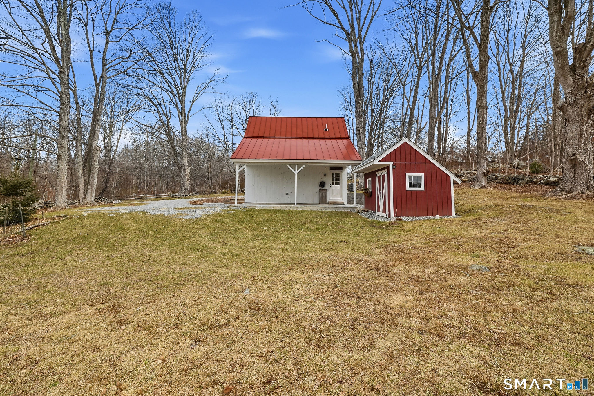 134 Sterling City Road Lyme, CT 06371 - Photo 2 of 38 Barn side carport includes EV charging station for seamless electric vehicle ownership.