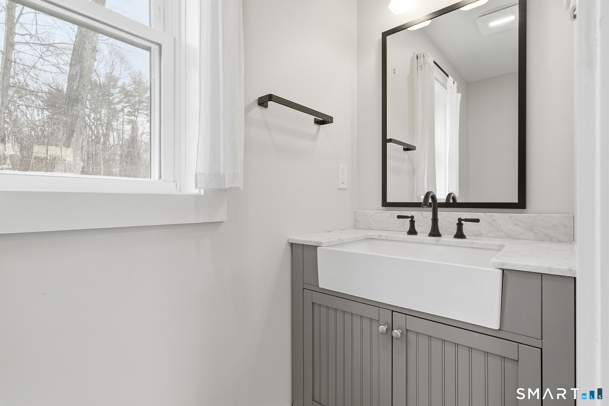 134 Sterling City Road Lyme, CT 06371 - Photo 28 of 38 The well appointed barn includes a modern half bath, adding convenience and functionality to this versatile outbuilding.