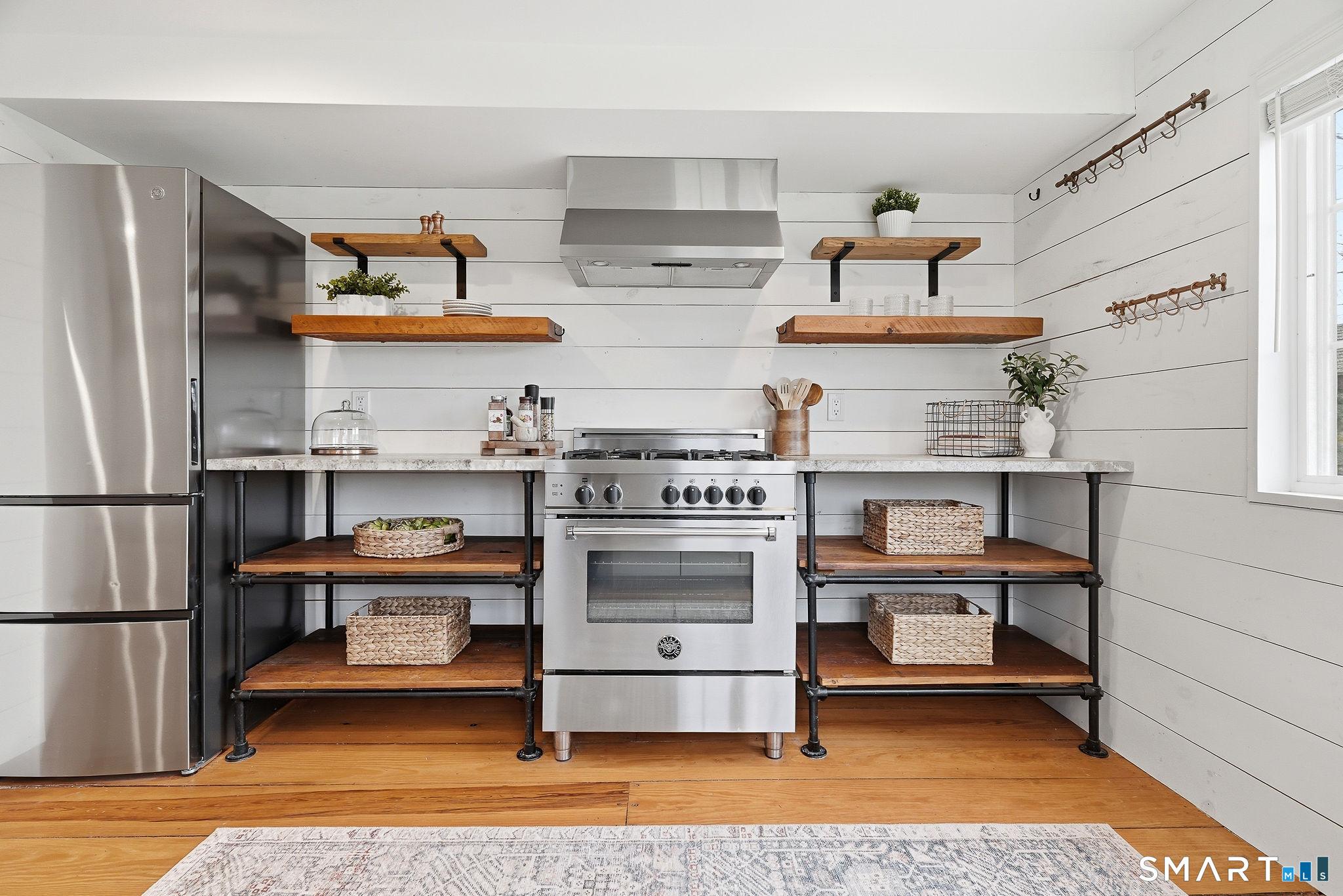 134 Sterling City Road Lyme, CT 06371 - Photo 4 of 38 The on trend kitchen showcases open shelving, blending modern design with smart storage and effortless style.