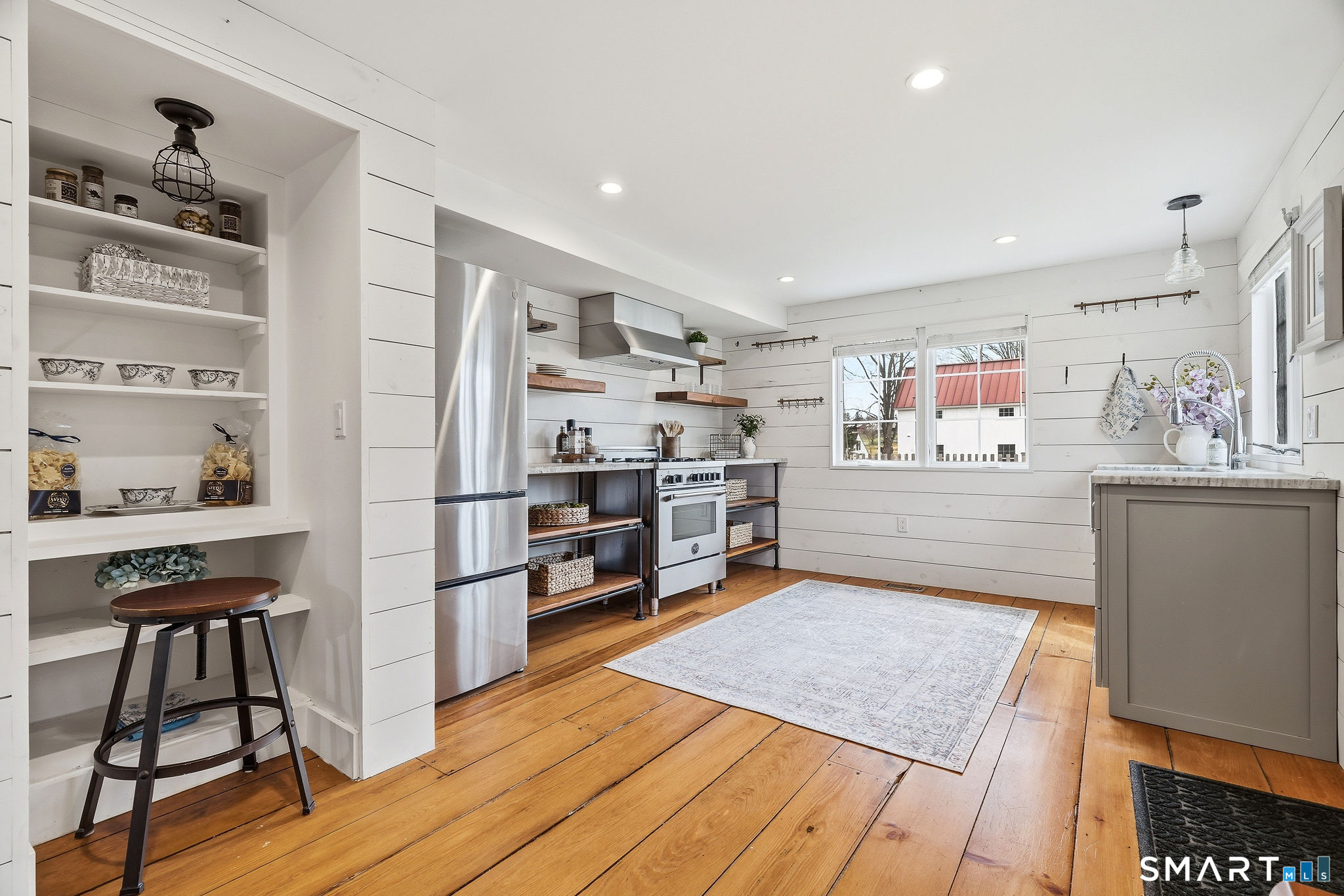 134 Sterling City Road Lyme, CT 06371 - Photo 6 of 38 The kitchen features a built in open storage nook,offering convenient display and organization in one stylish detail.